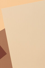 Abstract colored paper geometry composition background with beige, yellow, light brown and dark brown color tones