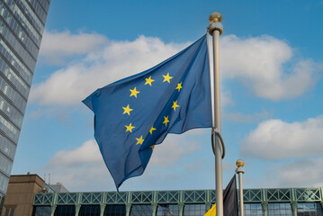 EU flag blue on the background of the building - obrazy, fototapety, plakaty