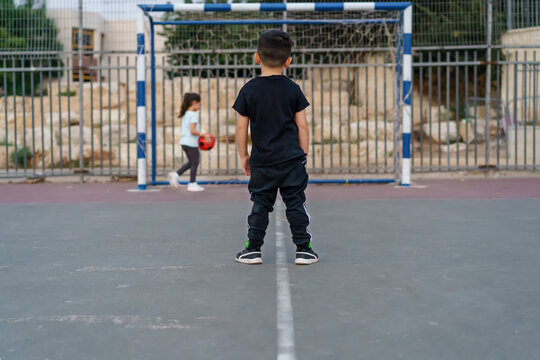 Children playing football. Selective focus on boy.