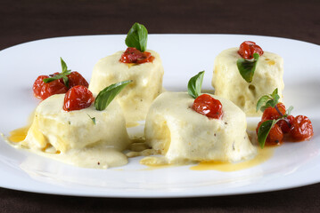 deliciuns rondelli and cannelloni pasta in white sauce with parmesan cheese nhoque