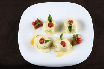 deliciuns rondelli and cannelloni pasta in white sauce with parmesan cheese nhoque