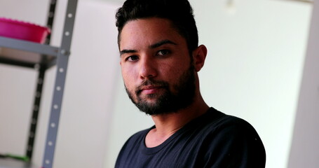 Hispanic man portrait face standing looking at camera. Casual person
