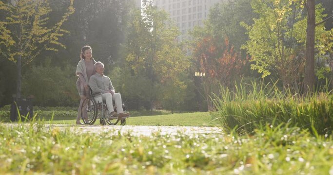 Senior Chinese woman with wheelchair bound husband,4K