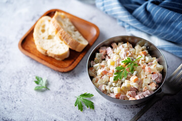 Potatoes green peas carrots sausage salad with mayonnaise