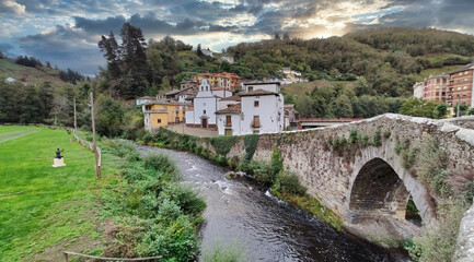 Cangas del Narcea, El Cascarin district where is El Carmen chapel and the roman bridge next to...