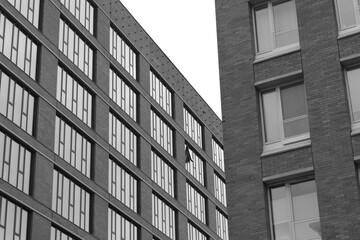 Fototapeta premium Residential apartment modern housing. Glass City architecture. Luxury business building. Family home. Skyscraper or hotel. Grey picture