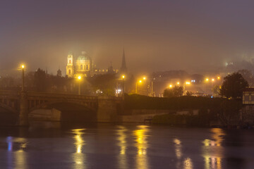 Fototapeta na wymiar View of Vltava river and Prague New Town during the autumn night