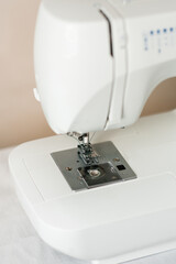 Close-up of a sewing machine with a needle and thread