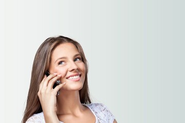 Fototapeta premium Happy young woman with modern smartphone