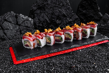 rolls with tuna on a black background