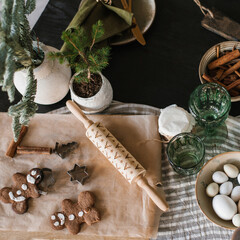 Christmas table with ginger cookies and rustic dishes. Flat lay