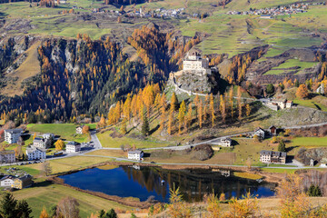 High view of the Tarasp Castle in autumn splendid color