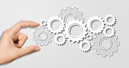Business automation, hand hold set of gears