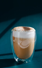 pumpkin cinnamon spice latte on blue background