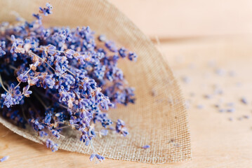 Obraz na płótnie Canvas Bouquet of lavender flowers on a wooden background. Aromatherapy.