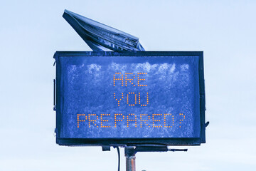 Photo illustration of digital road sign in winter with text Are You Prepared ? to convey a concept...