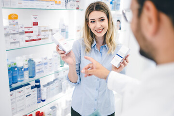 Young man working in pharmacy
Helping his client to pick up best products
Pharmacist recomending...
