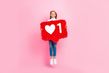 Full length photo of cheerful energetic girl jumping hands hold large like collage isolated on pink...