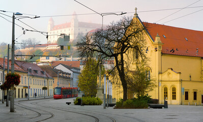 Fototapeta na wymiar Early morning in center of Bratislava with tramline and historic architecture..
