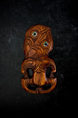 Wooden Maori Hei Tiki hand carved with paua shell eyes. New Zealand taonga.
