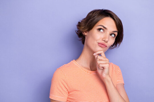 Closeup photo of young cute face minded girl touch chin idea thoughtful genius pouted lips advertisement offer curious empty space isolated on violet color background