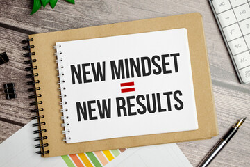 New Mindset - New Results on brown notebook and charts