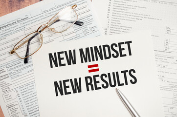 New Mindset - New Results text on paper and tax forms