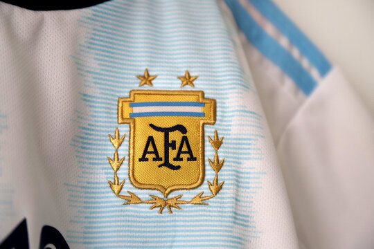 Argentina soccer jersey. Lionel Messi shirt. Number 10. light blue and white. AFA logo. Argentine Football Association. Adidas. Shield. Soccer player.
