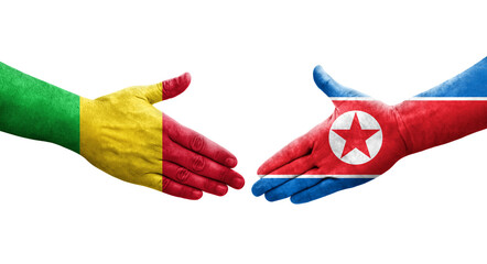 Handshake between Mali and North Korea flags painted on hands, isolated transparent image.