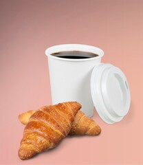 Coffee paper cup with fresh tasty croissant