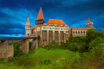 Fototapeta na wymiar Corvin Castle is on the green mountain of Romania.
