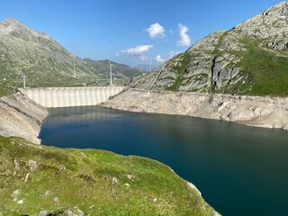 Fototapeta na wymiar Artificial reservoir lake Lago di Lucendro or accumulation lake Lucendro in the Swiss alpine area of the St. Gotthard Pass (Gotthardpass), Airolo - Canton of Ticino (Tessin), Switzerland (Schweiz)