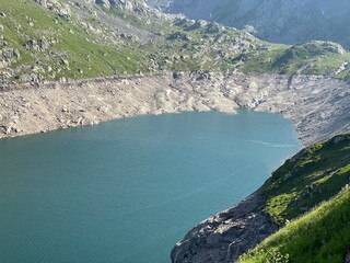 Artificial reservoir lake Lago di Lucendro or accumulation lake Lucendro in the Swiss alpine area of the St. Gotthard Pass (Gotthardpass), Airolo - Canton of Ticino (Tessin), Switzerland (Schweiz)