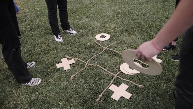 a company of people playing tic tac toe