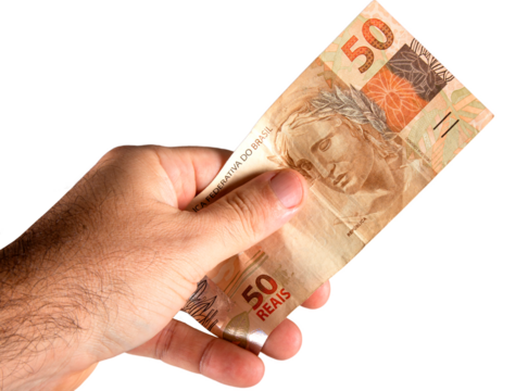 Hand holding fifty dollar bills. Brazilian money. png transparent background