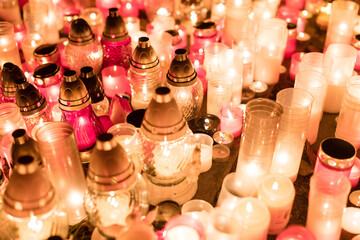 Burning candles on cemetery during All Saints' day