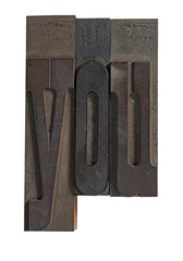 Isolated vintage printing letterpress wood blocks spelling you