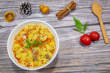 Macaroni Soup with Carrots and Tomatoes Breakfast on a cold day.