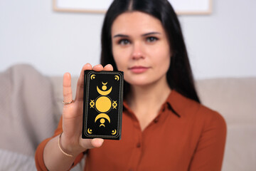 Soothsayer predicting future indoors. Focus on tarot cards