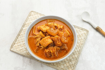 Sambal Goreng Krecek Tahu, Indonesian traditional food, made from cattle skin crackers with tofu and coconut milk. Served in bowl.
