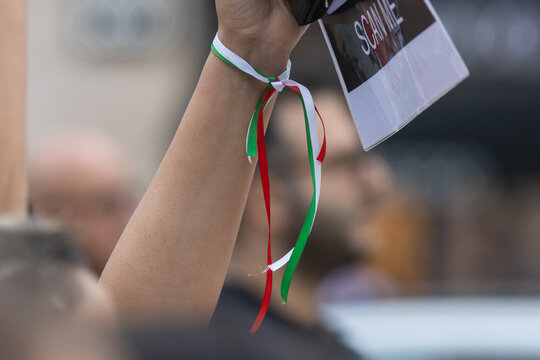 Rally dedicated to the incident in Iran - the ribbon on the wrist is the color of the flag of Iran