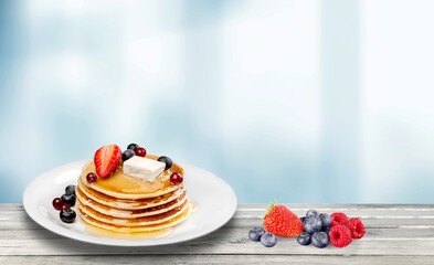 Delicious tasty sweet pancakes with topping.