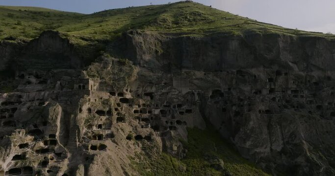 Drone Ascending Through Vardzia Cave Monastery And City Rock In Southern Georgia. Aerial Shot