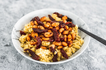 plant-based Moroccan cous cous with sundried tomatoes and butter beans with spicy seasonings