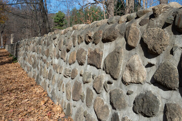 A background of stones and cement wall