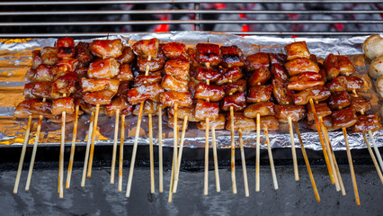 grilled pork intestine in barbecue sticks on the grill