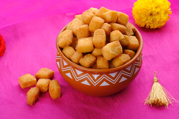 Shakkar pare / Shakkarpare / shankar pale is a sweet tea time snack food from India, Traditional homemade indian maharashtrian Diwali Festival sweet snack food.
