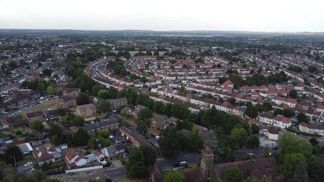 Drone view of a beautiful town with houses and trees under the cloudy sky