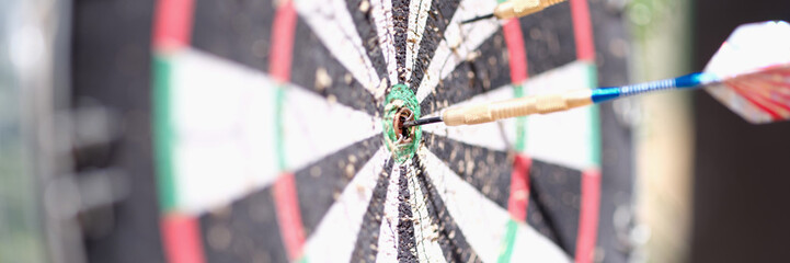 Game darts with dart in center closeup
