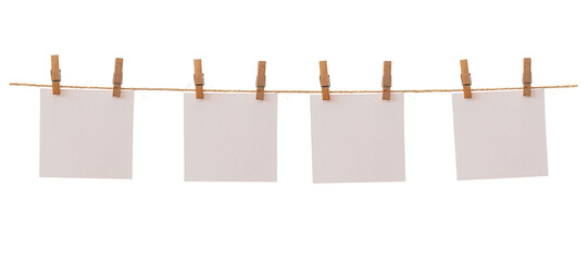 Four frames that hang on a rope with clothespins and isolated on white. Blank cards on rope mockup...